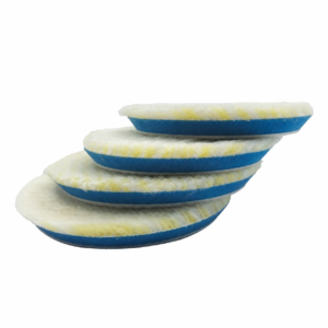 Cream wool buffing pads with blue foam backing stacked on a white background